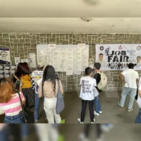 Job seekers attending a recruitment job fair hosted by an accredited Philippine recruitment agency offering overseas employment opportunities.